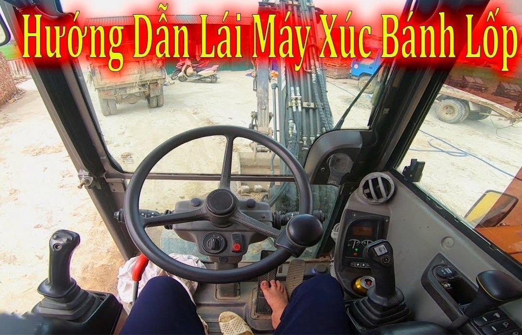 Cách lái máy xúc bánh lốp